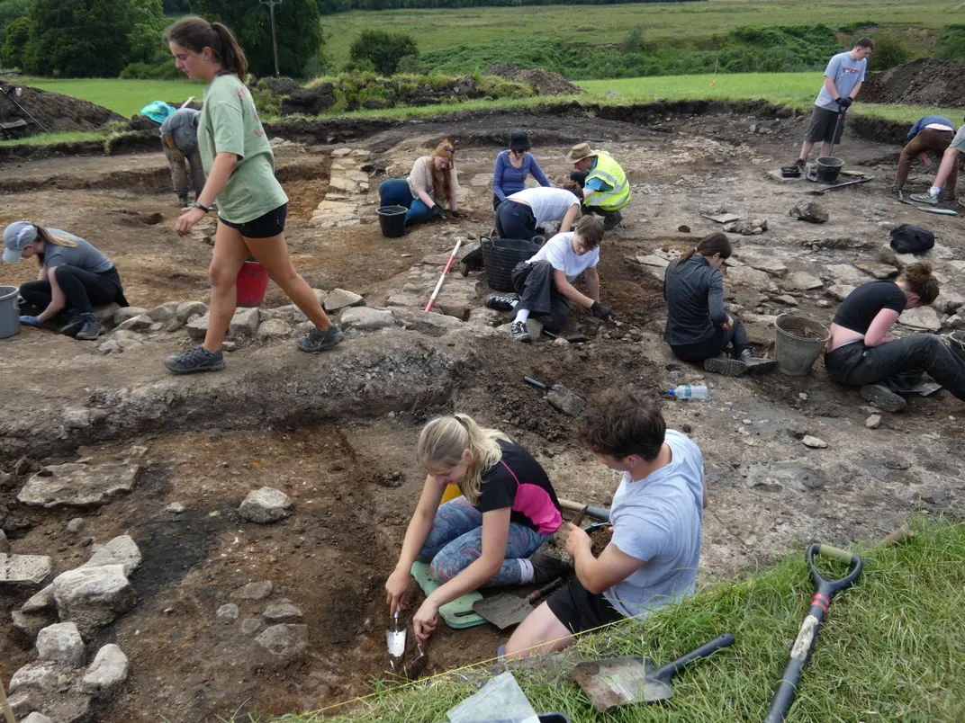 People excavating an archaeological site