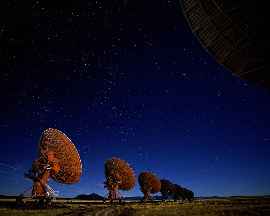 Large radio telescopes dot the horizon
