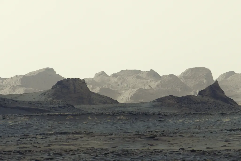 a grey-blue-whitish desert-like landscape