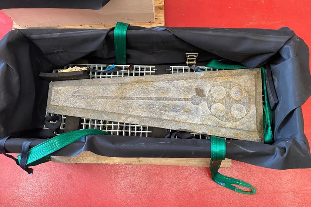 Grave slab in a crate as seen from above