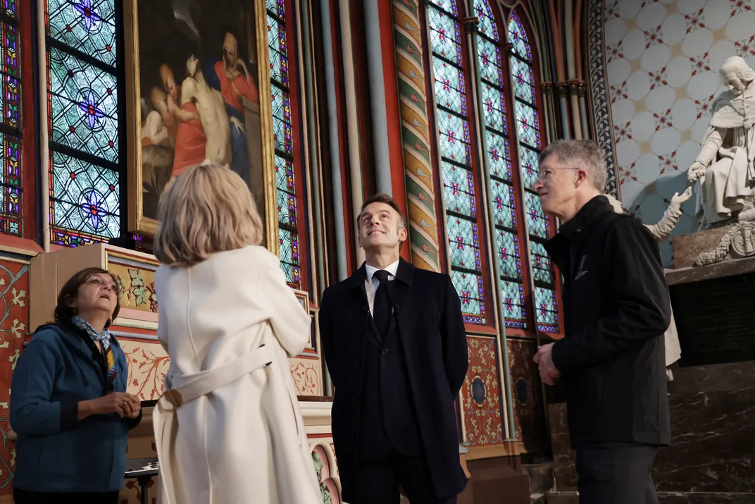 Two men and two women looking up at ceiling inside cathedral