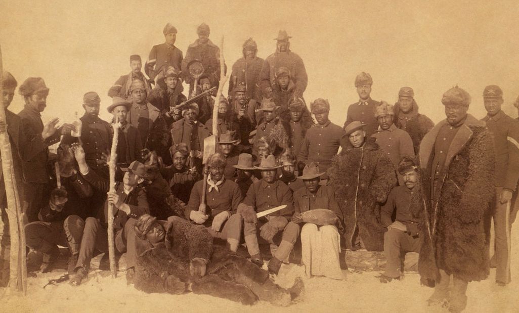 Buffalo soldiers of the 25th Infantry, some wearing buffalo robes, Ft. Keogh, Montana
