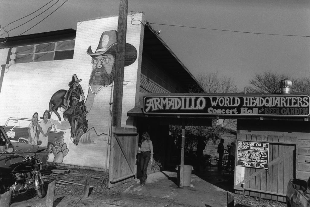 A black and white image of the entrance to the Armadillo venue