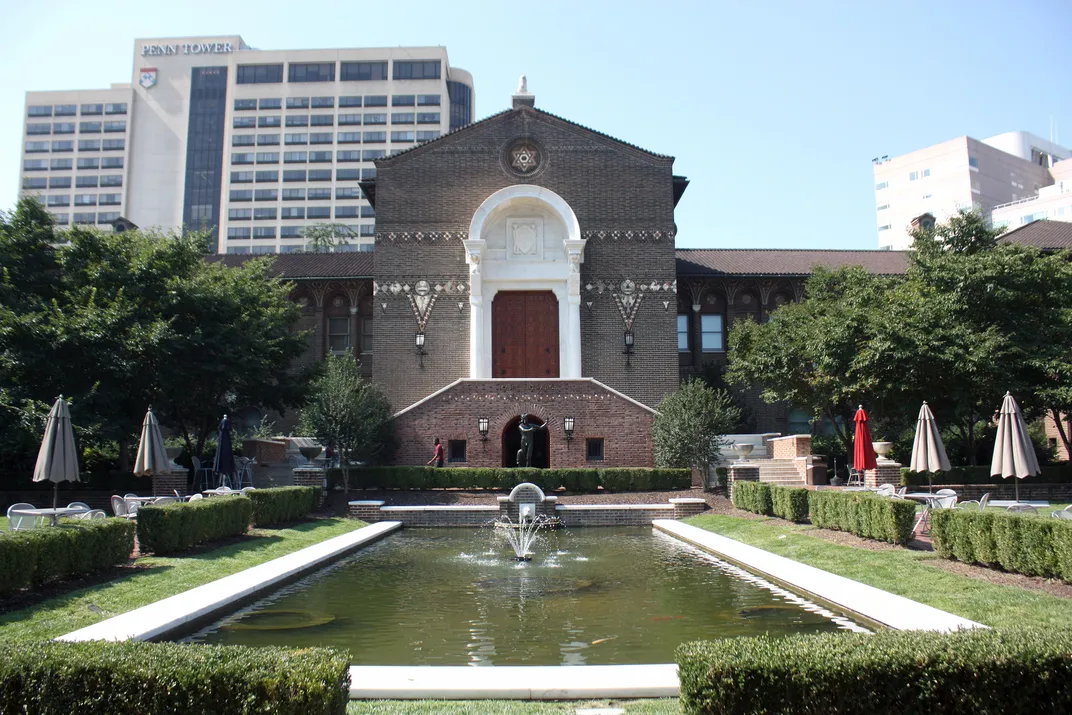 The front garden, reflecting pool and main entrance of the Penn Museum