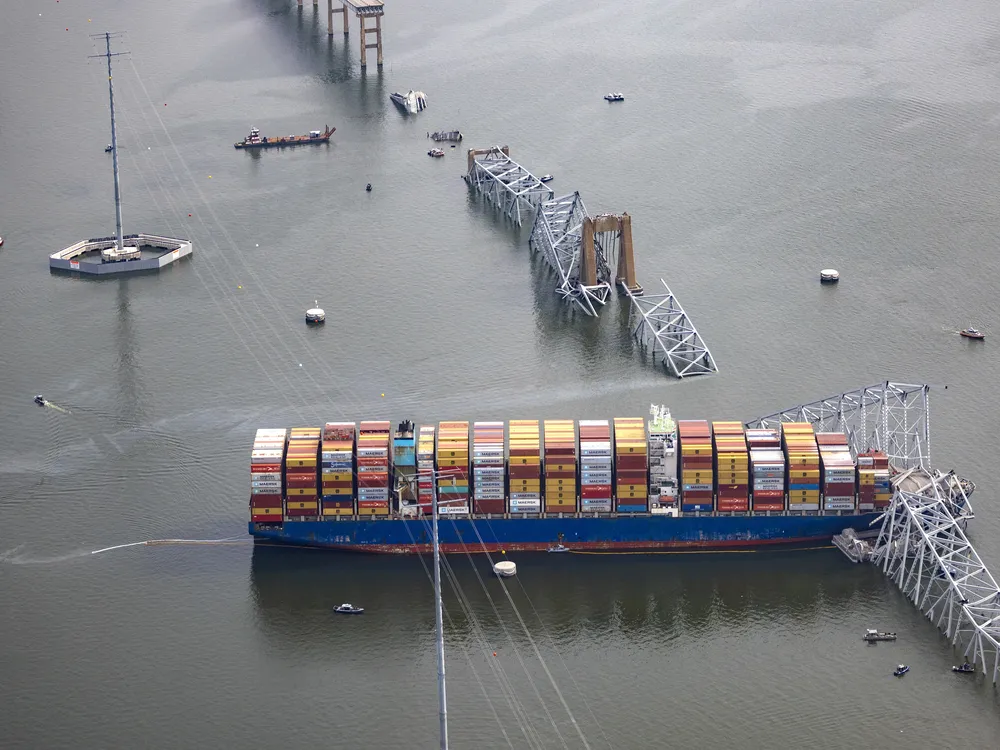 Cargo ship and collapsed bridge