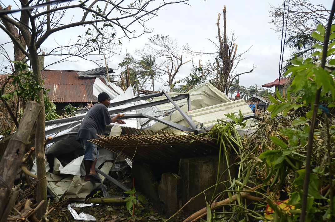 The man is wondering how this roof landed inside his backyard. Photo ...