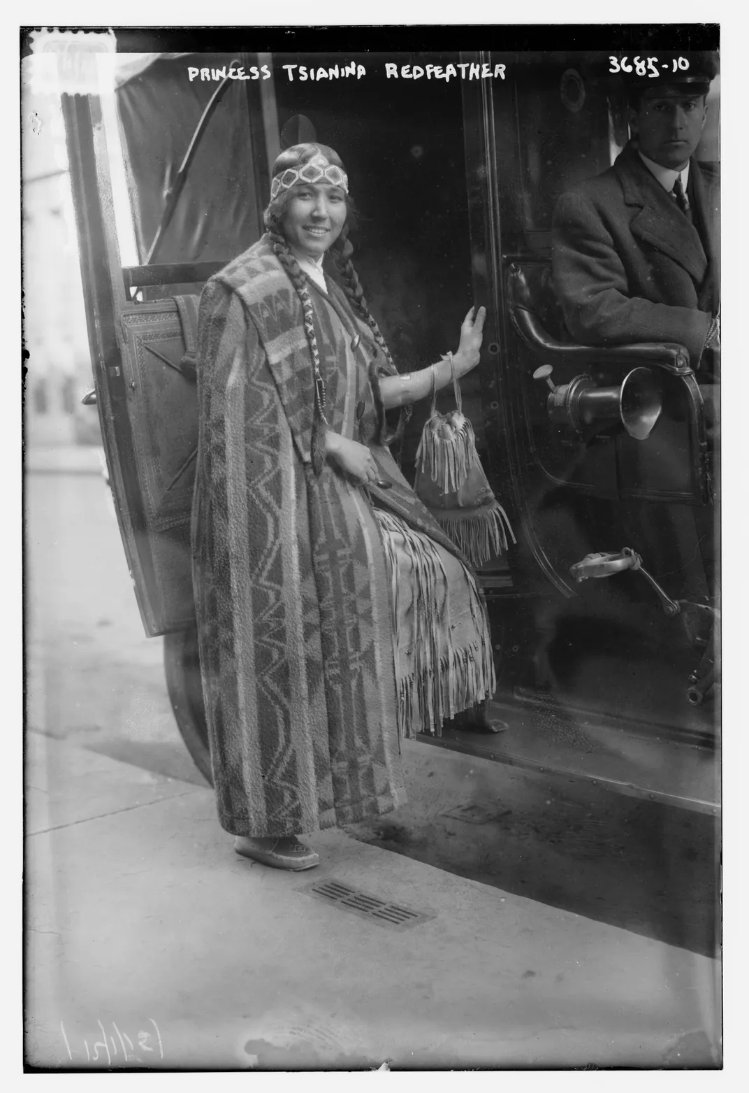 Tsianina Redfeather stepping into a car