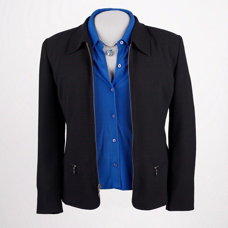 Black suit jacket, blue blouse, and a necklace