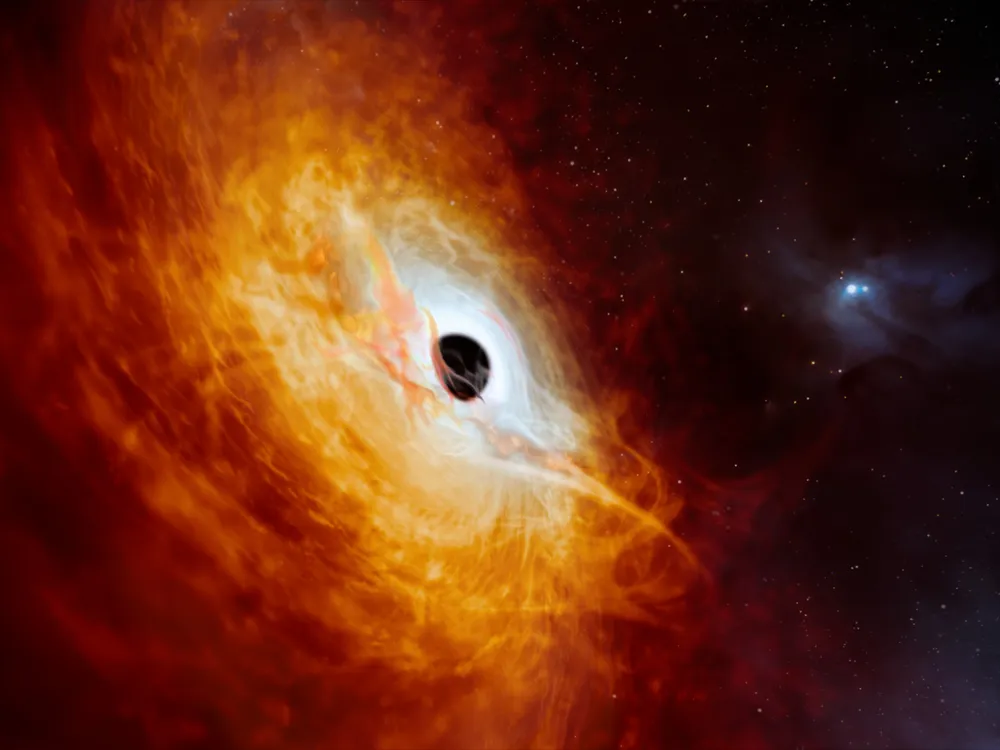 An artist's rendering of a fiery galactic core swirling around a black hole at its cennter