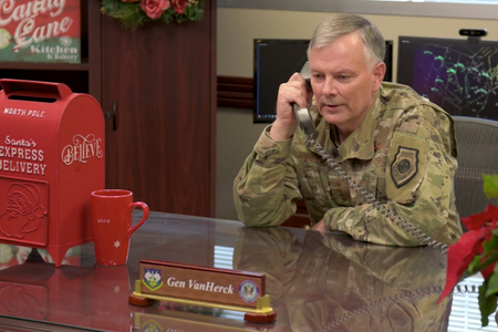 Gen. Glen VanHerck, Commander of North American Aerospace Defense Command and U.S. Northern Command talks on the phone as part of a video celebrating the NORAD Santa Tracker's 65th year.