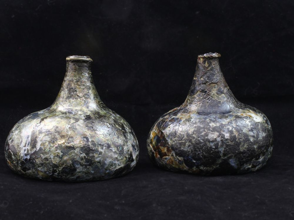 Bottles against a black backdrop