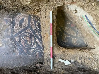 Archaeologists are uncovering a Roman mosaic located in front of a vape shop at a shopping mall in southeast England.