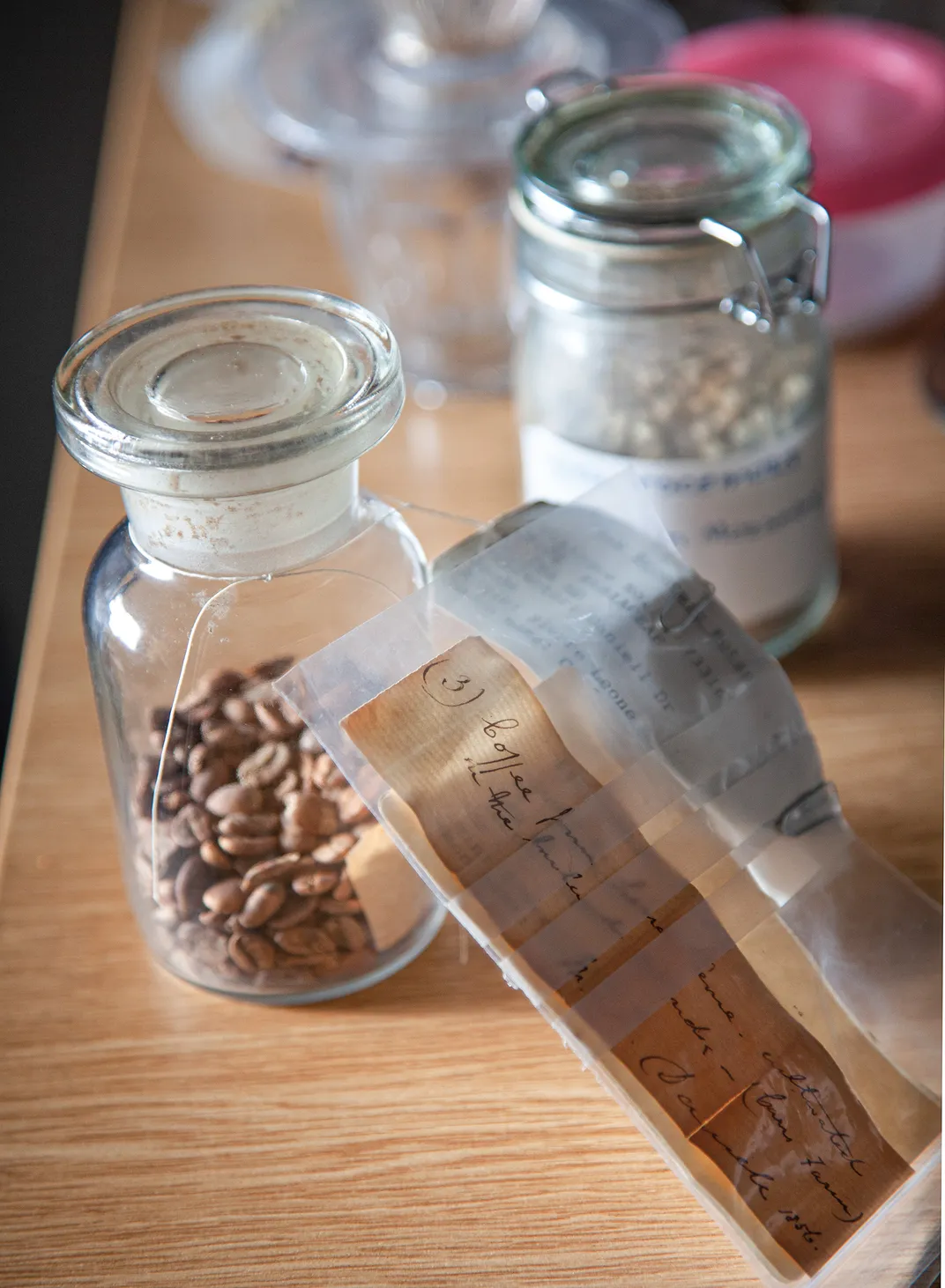 a glass jar of coffee beans