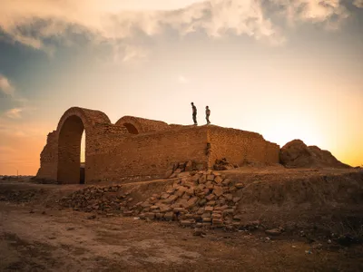 Children stand on the surrounding wall at Tabira Gate, the entrance to Assur, first capital of the Assyrian empire in present day Shirqat, Iraq.
