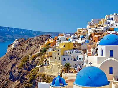 Santorini’s villages cling to red-and-black cliffs, looking out on a nearly enclosed 400-foot-deep lagoon; this deep harbor was formed when a catastrophic volcanic eruption occurred some 3,600 years, creating a massive crater.