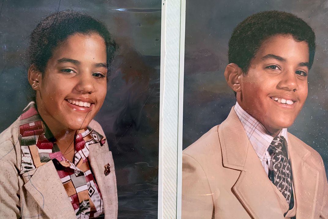 School portraits of twin brother and sister, high school age and both in suit jackets and smiling. Photos placed side by side.
