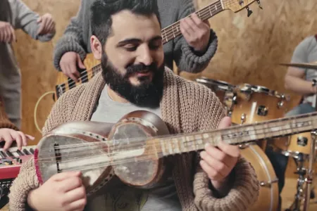 Miqayel Voskanyan plays the tar, an Armenian folk instrument.