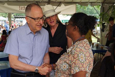 Smithsonian Secretary David Skorton and his wife, Robin Davisson, greet Marie Dieng at the Institution's staff picnic on the National Mall. Skorton begins his tenure as the 13th Secretary on July 1. 