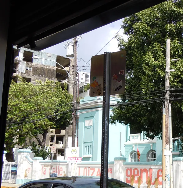 Signs of destruction and rebirth along Calle Loiza, San Juan. thumbnail
