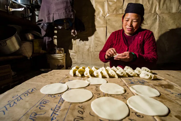 A Nepali woman prepares momo.