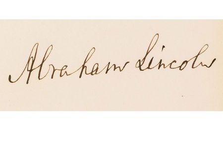 A close-up of Abraham Lincoln's signature on the Emancipation Proclamation.