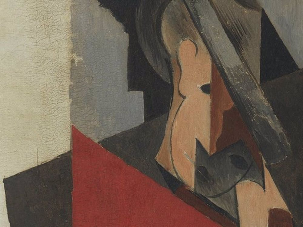 A close up of a man's Cubist portrait, who appears to be wearing a hat and is composed of angular shapes; various cracks are visible 