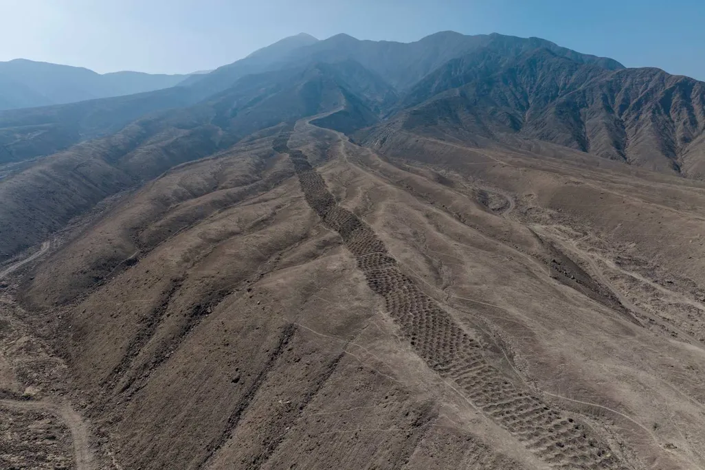 Aerial shot of a line of holes in the landscape