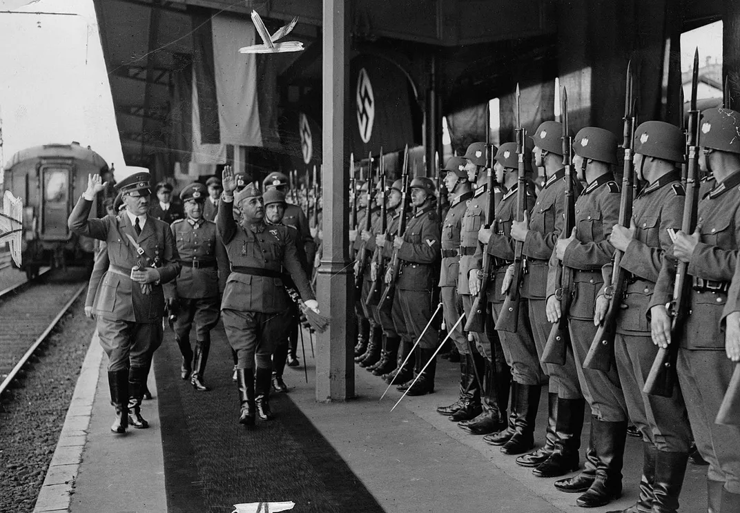 Adolf Hitler (far left) and Francisco Franco (greeting right) in October 1940.