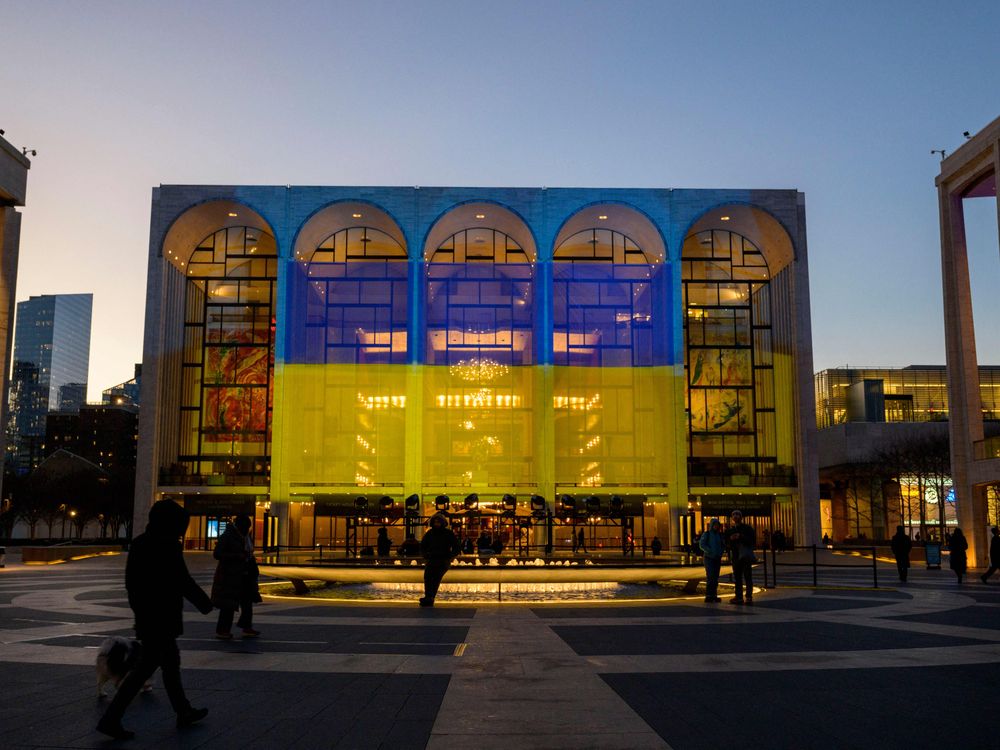 The Ukrainian flag hangs on the Metropolitan Opera House at Lincoln Center in February 2023