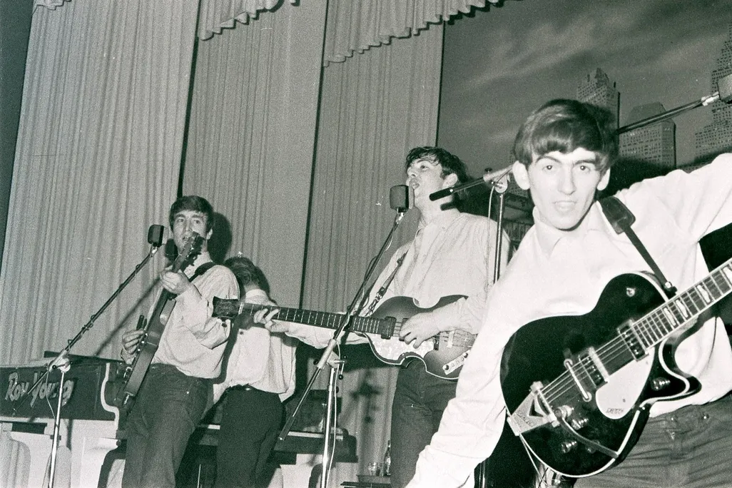 John Lennon, Paul McCartney and George Harrison perform at the Star-Club in Hamburg, Germany, in May 1962