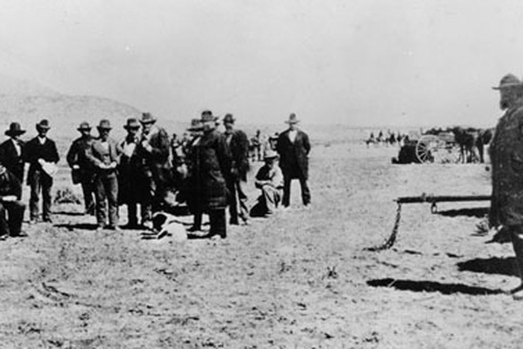 John D. Lee, seated on his coffin, moments before his execution.