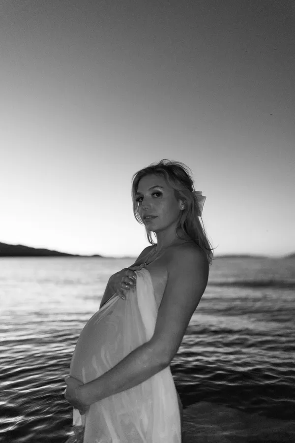 Black & white photo of mother to be in the water. thumbnail