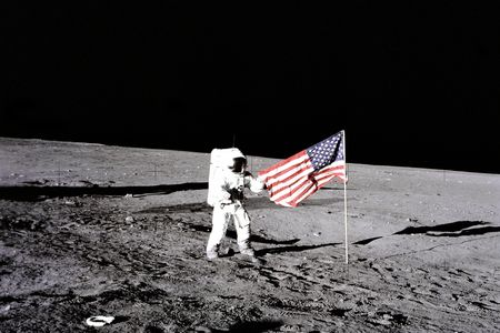 Astronaut Charles "Pete" Conrad sets up the American flag on the Moon during Apollo 12 on November 19, 1969.