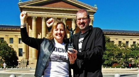 Larissa and Michael Milne, shown here in their hometown of Philadelphia, sold nearly all their belongings in 2011 and embarked on a tour of the world. Along the way they visited the frightening but fascinating country of North Korea. Also shown in this photo is the Milnes’ travel companion, “Little Rocky,” a six-inch figurine of one of Philadelphia’s most famous native sons.