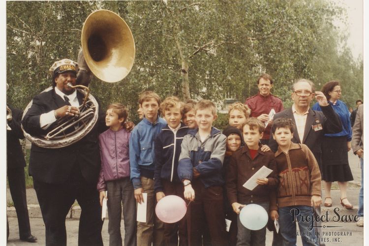 Young Tuxedo Brass Band member with Ukrainian youth in Kyiv