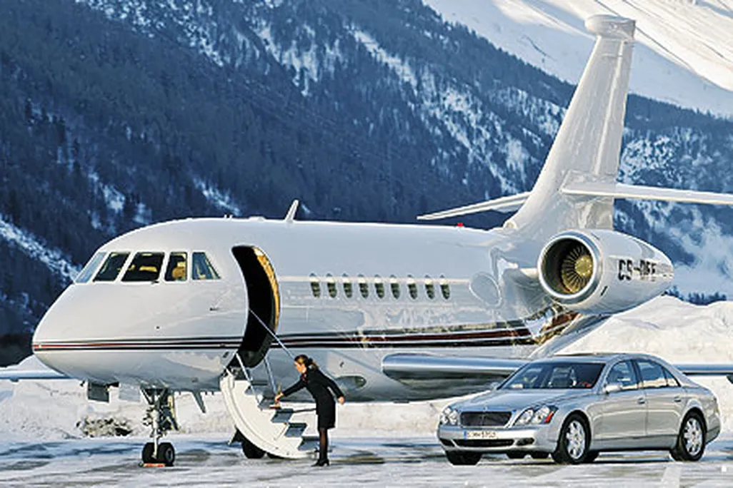 A Dassault Falcon 2000, a Maybach luxury auto, and freshly swept stairs: NetJets set up this publicity shot in Switzerland, but for fractional jet owners, such fantasy is the reality.