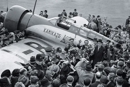 Some 6,000 curiosity-seekers greeted Masaaki Iinuma (left) and Kenji Tsukagoshi at London’s Croydon Airport. Despite a grueling flight, the airmen spent the next month on a goodwill tour of Europe.