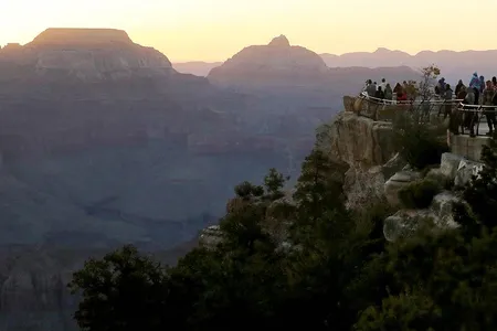 Visitors gather on the South Rim of Grand Canyon National Park after its reopening.