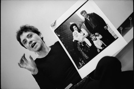 Diane Arbus with her photograph A young Brooklyn family going for a Sunday outing, N.Y.C., 1966