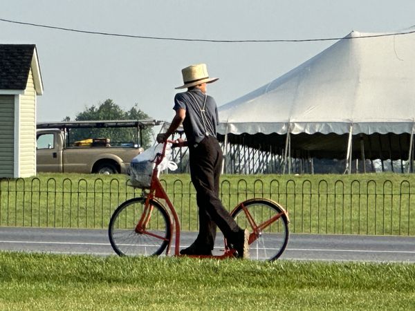Amish boy riding a scooter thumbnail