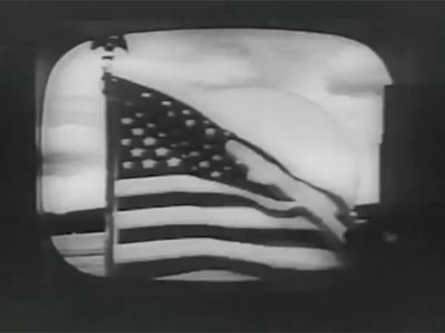An American flag waving in Andover, Maine. This was the first video ever transmitted by commercial satellite.