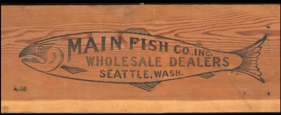 Labeled side of wood shipping crate with large fish and text inside