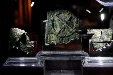 Artifacts from the Antikythera Shipwreck, the famous mechanism in the center, as exhibited in Athens, Greece
