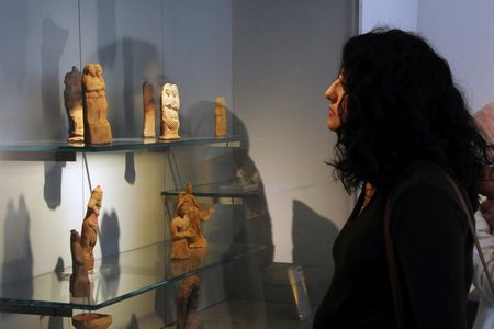 A visitor at the reopening ceremony for Syria's National Museum, in Damascus, Syria.