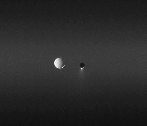 Two of Saturn's satellites, side by side.