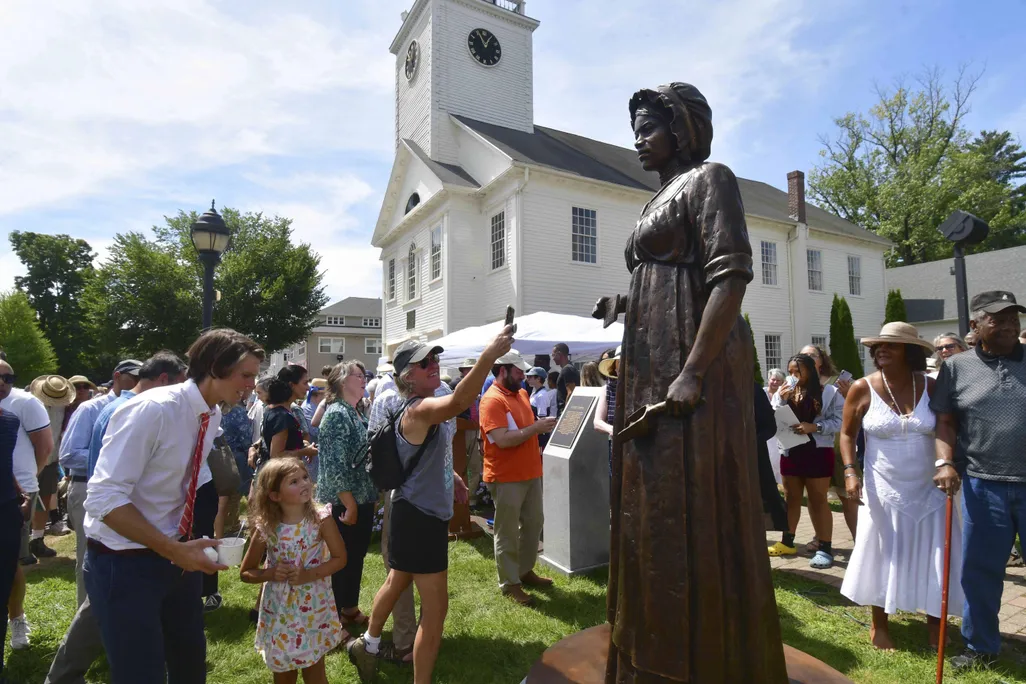 A monument of civil rights pioneer Elizabeth Freeman is unveiled in front of Sheffield's Old Parish Church in Sheffield, Massachusetts.