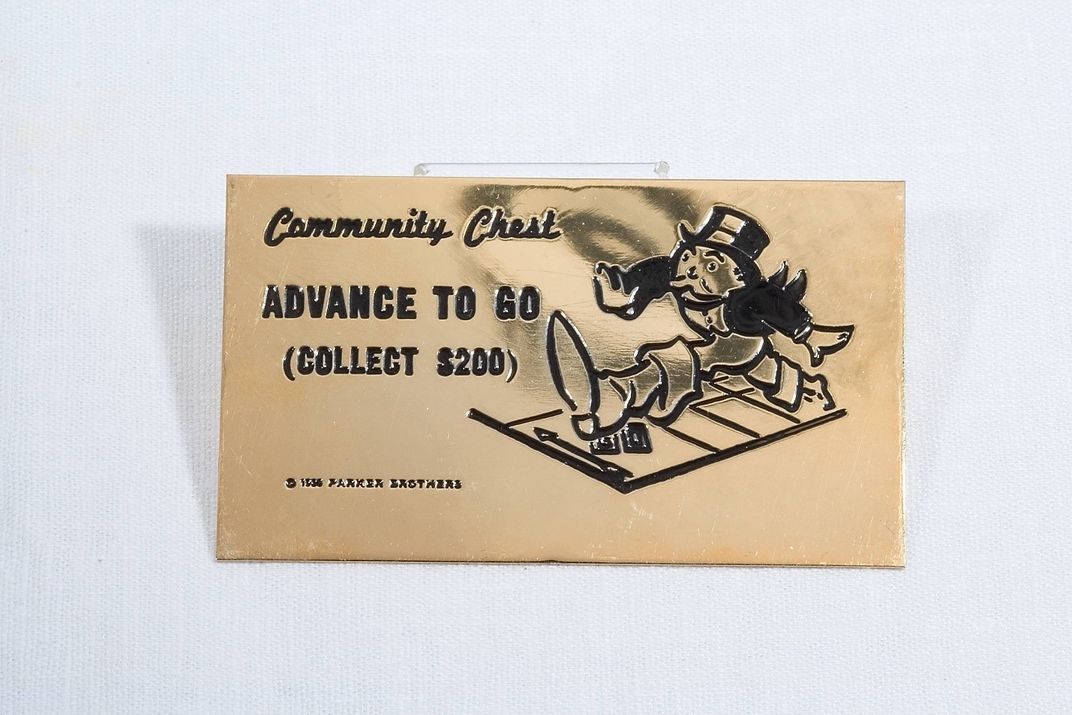 23-carat gold-plated Community Chest card with "Advance to Go (Collect $200)" engraved in black. 