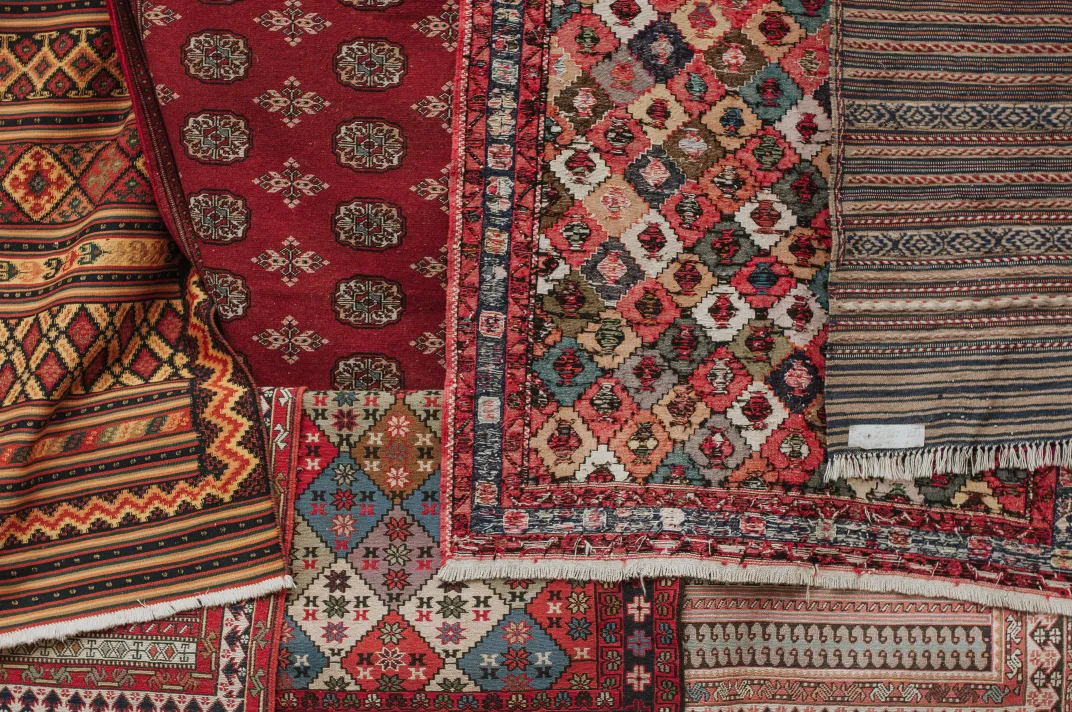 A number of rugs with repeating patterns