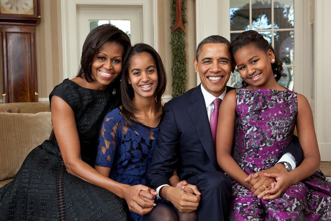 L to R: Michelle, Malia, Barack and Sasha Obama in 2011