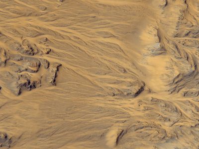 Evidence for flowing water on Mars, as seen by the HiRISE camera on the Mars Reconnaissance Orbiter. How much was contributed by rainfall?